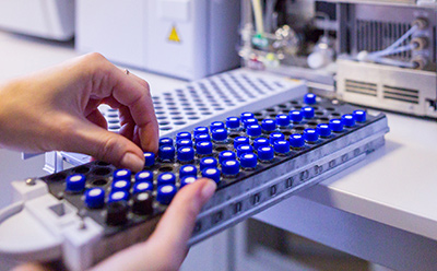 Scientist holding an HPLC chromatogram