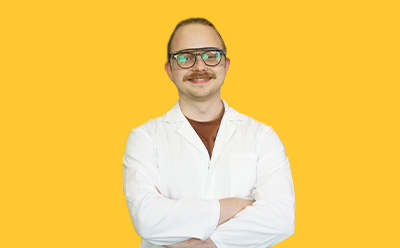 Zarrar Nashman headshot on a vibrant yellow background