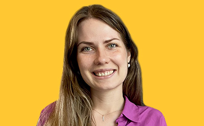 Oliwia Marjchrzak headshot on a vibrant yellow background