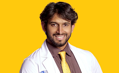 Zarrar Nashman headshot on a vibrant yellow background