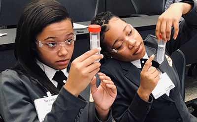 BioSTL Girls Observing Flasks