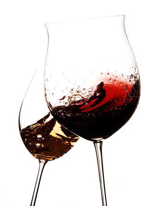 Two glasses of splashing red wine