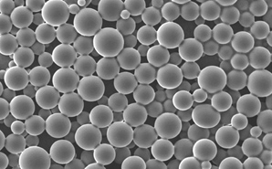  Close-up grayscale of numerous spherical microspheres with a smooth surface, varying slightly in size and densely packed together, representing API-loaded PLGA (poly(lactic-co-glycolic acid)) microspheres used in pharmaceutical applications for controlled drug release.