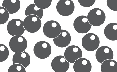 Close-up image of synthetic activated carbon Close-up view of synthetic activated carbon particles, showcasing their spherical shape and dark coloration against a white background.