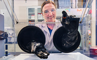 A digital illustration of a laptop displaying a simplistic human figure next to a pink rectangle, all set against a yellow background.