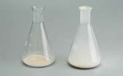 Granulated and powdered microbial culture media in Erlenmeyer flasks